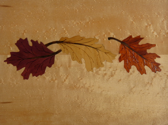 T107 curved tray with three maple leaves on birdseye maple